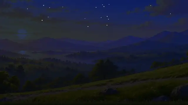 A hillside above a lake and mountains at night, under the stars, just before dawn.